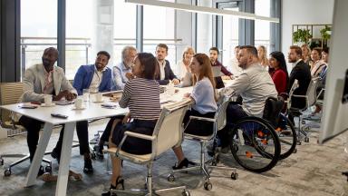 Members meeting around a table 