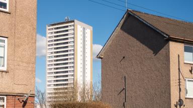 A block of flats between houses