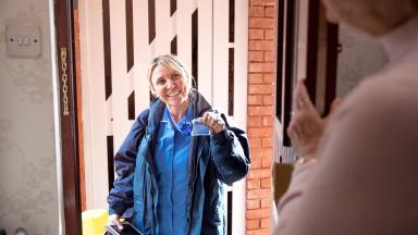 Community nurse at patient's door