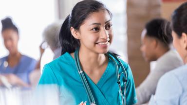 A smiling doctor having a conversation.