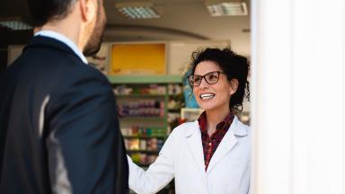 A pharmacist with customer.