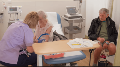 Older female patient being treated by a clinican