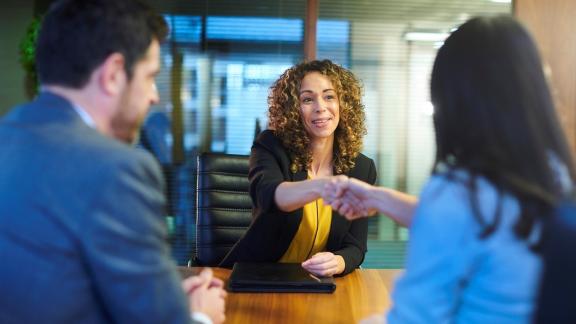 image of lady shaking hands with interviewers