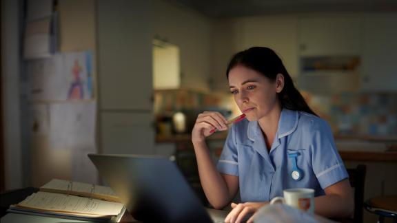 Image of a nurse at a computer