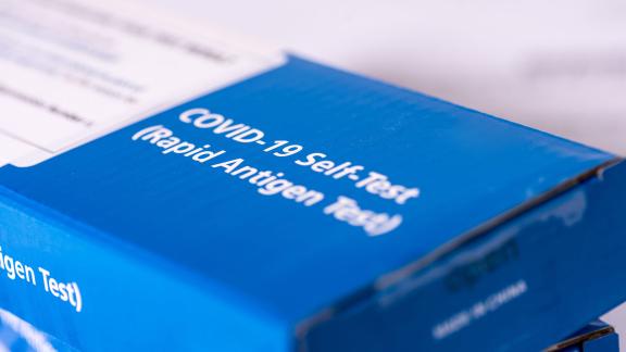 A pile of COVID-19 self test kits.