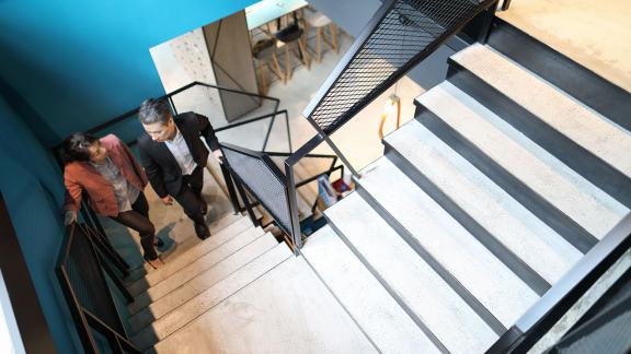 Delegates climbing stairs