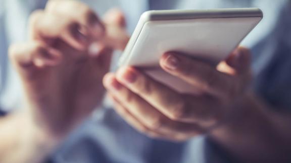 A close up of someone using a phone.