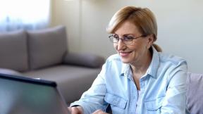 Image of lady looking at her laptop