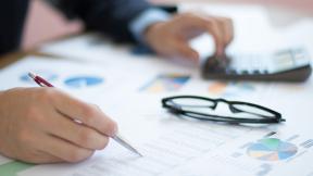 A man checking financial graphs.