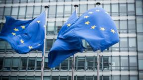 EU flags outside an office building.