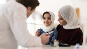 GP assessing a child with it's mother