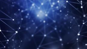 Abstract network of points lit up against dark background