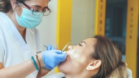 A dentist treating a patient.