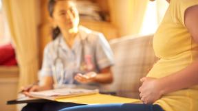 Midwife and patient on home visit