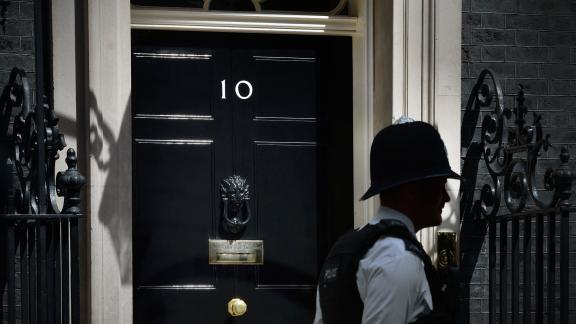 A police officer walks past 10 Downing Street.