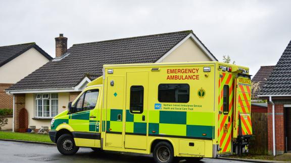 An ambulance outside a house.
