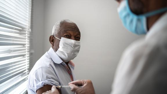 A man receiving the COVID-19 vaccination.