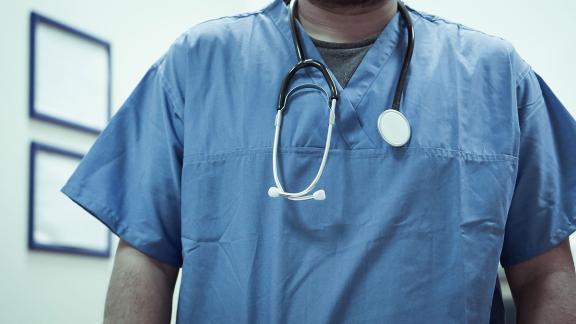 Close up of a doctor wearing a stethoscope.