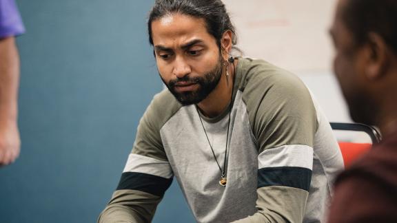 A man reflects during group counselling.