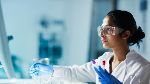 A healthcare scientist testing samples.