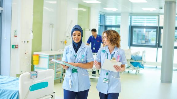 Healthcare staff walking on ward