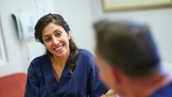 A healthcare worker smiling.