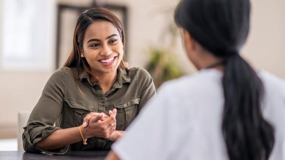 Two women having a conversation.