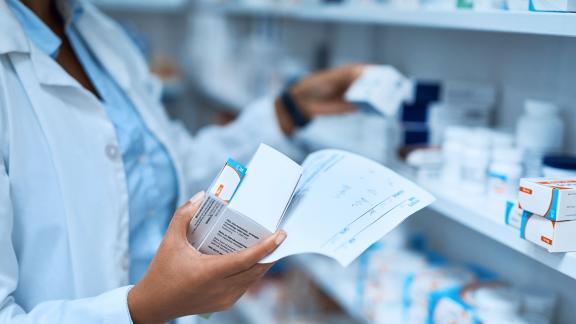 A pharmacist checking stock.