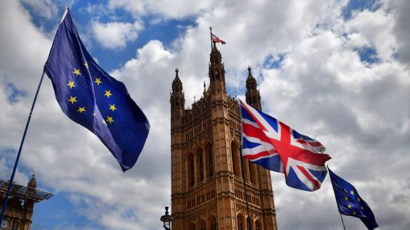 UK EU flags flying outside UK Parliament