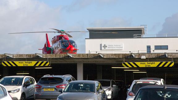 An air ambulance on top of a hospital in Wales.