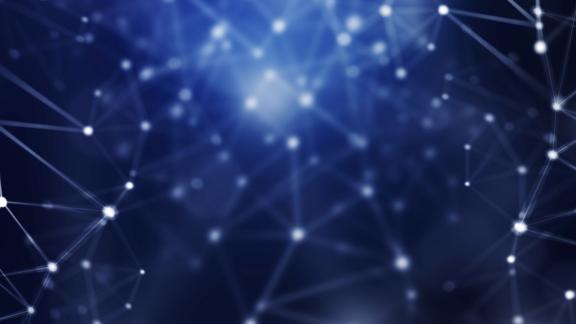 Abstract network of points lit up against dark background