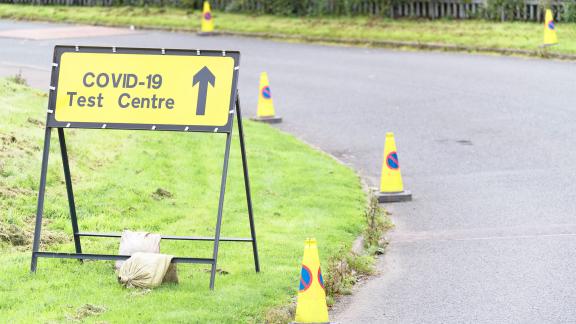 A road sign reading "COVID-19 test centre".