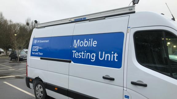 A van reading "Mobile testing unit".