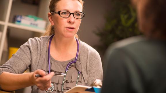 A doctor consulting a patient.