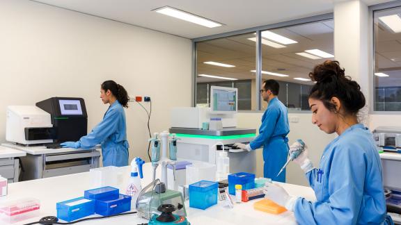 Three healthcare scientists in a lab.
