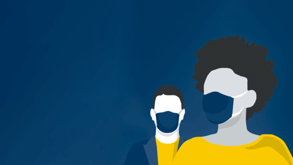 Two people wearing masks. 