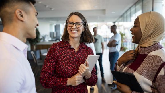 Smiling people talking in a group