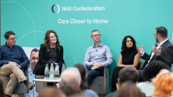 Speakers talking on stage at our Care Closer to Home conference 2025