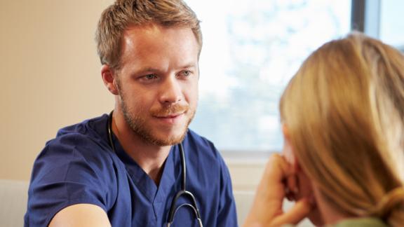 brochure-man-in-scrubs-with-woman.jpg