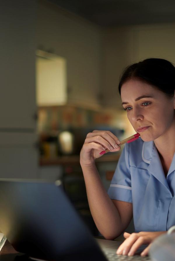 Image of a nurse at a computer