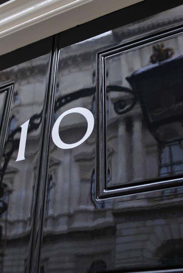 Close up of the number 10 on the front door of 10 Downing Street.