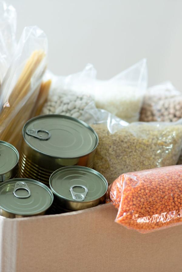 A filled food bank donation box.