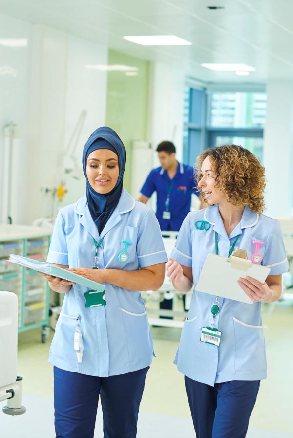 Healthcare staff walking on ward