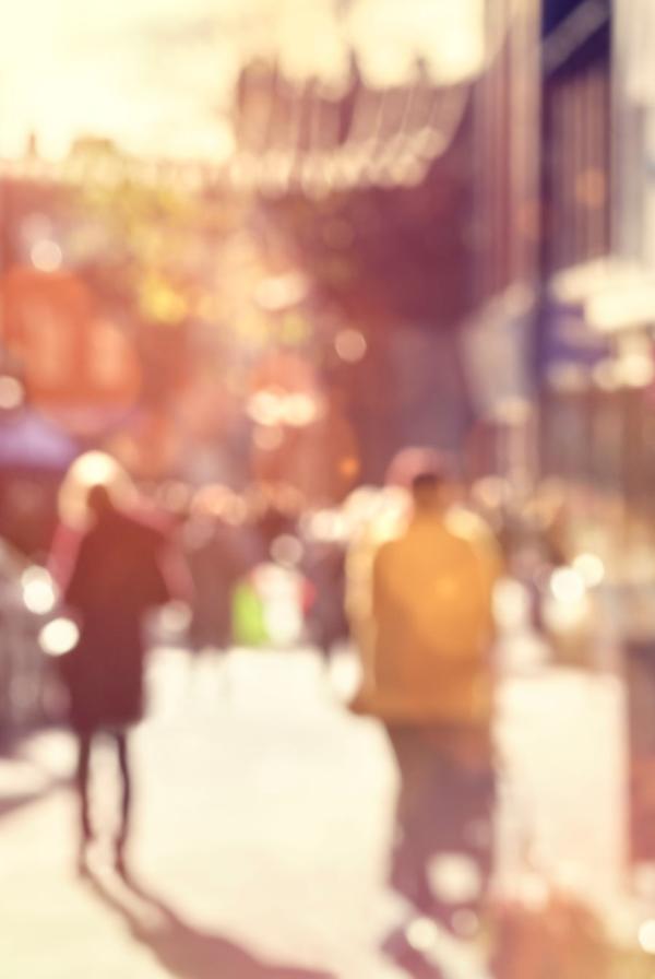 Crowd shopping on a high street, slightly blurred