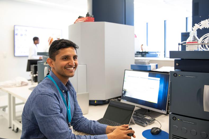 A healthcare scientist at a computer