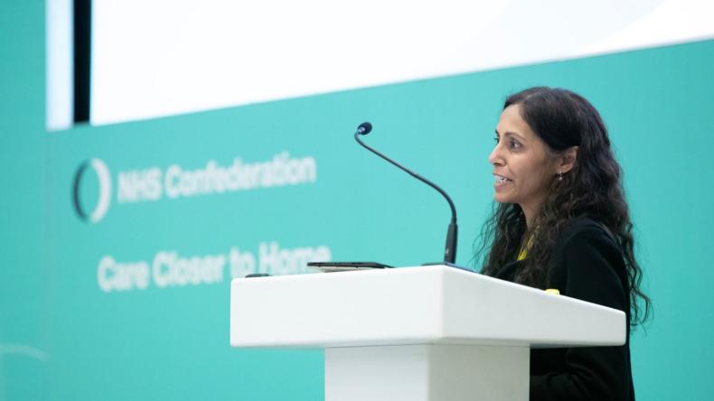 Aruna Garcea speaking at conference